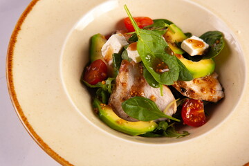 Avocado and poultry salad with sauce