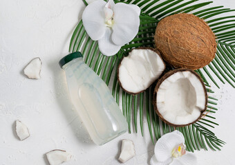 Coconut drink in a glass bottle on a white background