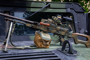 Machine gun shooting bursts in war