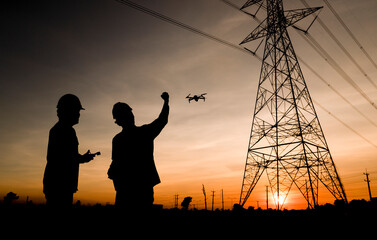 Two electrical engineers used drones to observe the planning work, producing electric power at high...
