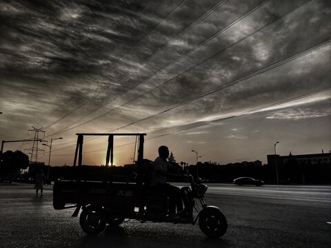 Silhouette of a Tricycle in the sunset