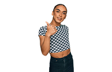 Hispanic transgender man wearing make up and long hair wearing modern clothes doing happy thumbs up gesture with hand. approving expression looking at the camera showing success.