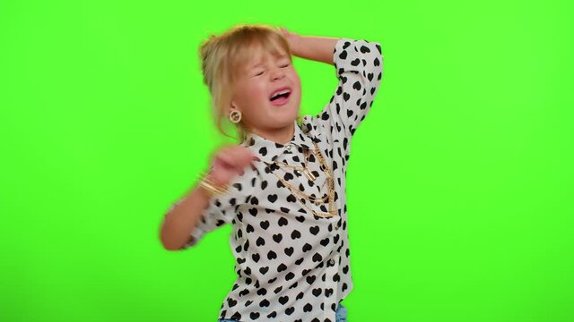 Little bit crazy funny playful blonde kid child 5-6 years old demonstrating tongue out, fooling around, making silly faces, madness. Lovely teenager children girl emotions on chroma key background