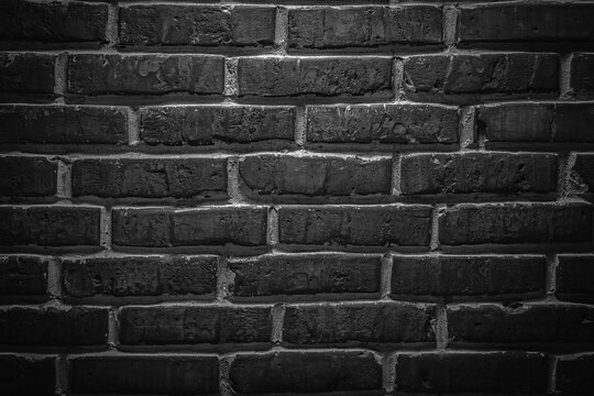 Fototapeta Black or dark gray sanded old loft brick wall texture background