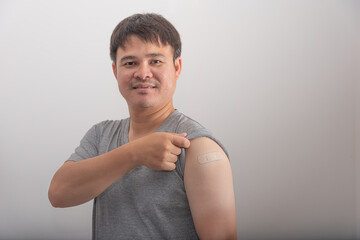 Asian man are happy after being vaccinated