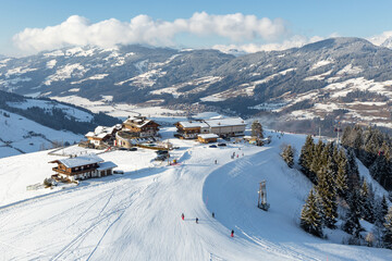 Elevated view of hotel and restaurant buildings  on the slopes at Kirchberg in Tirol, part of the...