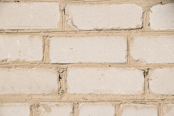 White brick wall in the warm light of the evening sun, copy space
