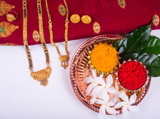 Mangalsutra or Golden Necklace to wear by a married hindu women, arranged with traditional saree...