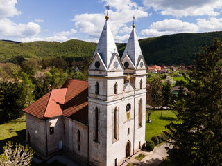 Fototapeta na wymiar Aerial view of the church in the village of Krasnohorska Dlha Luka in Slovakia