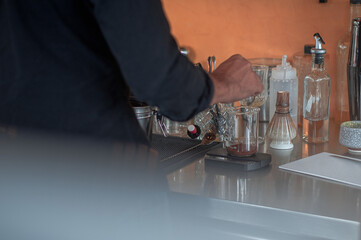 brista measuring coffee for making drinks