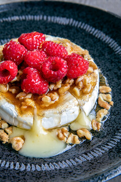 Baked brie with raspberries and walnuts