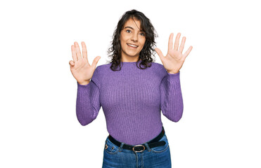 Young hispanic woman wearing casual clothes showing and pointing up with fingers number nine while...