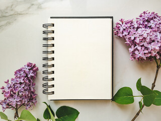 Blank notepad page for your congratulatory message. Closeup, view from above. No people. Concept of preparation for a holiday. Congratulations for relatives, friends and colleagues