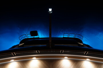 super yacht stern at night 