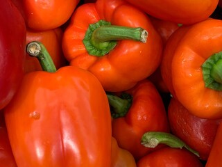 Orange bell pepper close up. The texture of nature in the wallpaper.