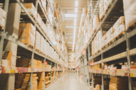Blurry background of warehouse interior inventory product stock for logistic background, global business for good import and export, stock storage industrial delivery, factory cargo container store