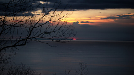 Fototapeta premium red sun with orange sky during sunset