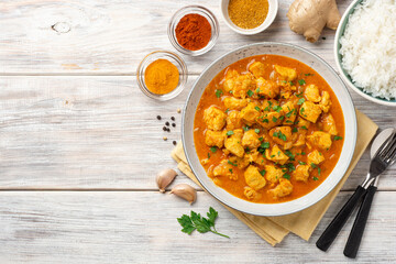 Chicken curry in plate on wooden background