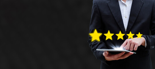 wide banner. 5 star rating. business man customer hand touching on mobile tablet with five star button to review good rating, digital marketing, good experience and customer feedback concept