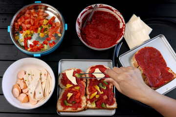 Top view pizza Young hands prepare pizza at home .Stay home concept preparing pizza in the kitchen