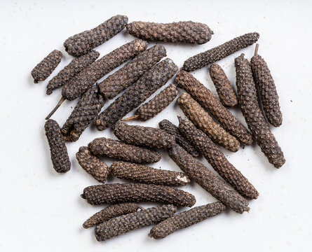 top view of java long pepper close up on gray