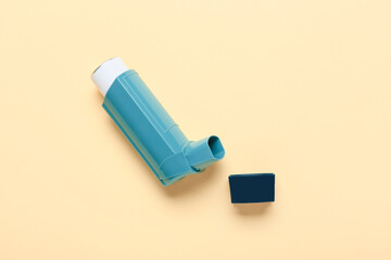 Modern inhaler on color background