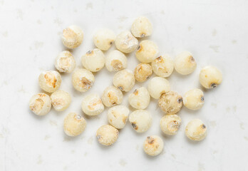 several raw polished Sorghum groats close up