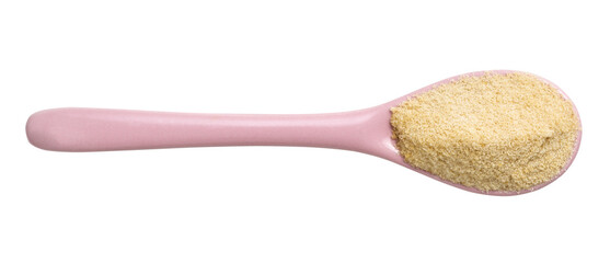 granulated coconut sugar in pink ceramic spoon