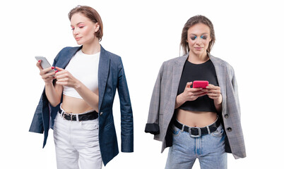 Portrait of two beautiful girls with mobile phones. White background.