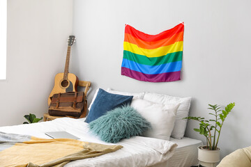 Flag of LGBT hanging on wall in interior of bedroom