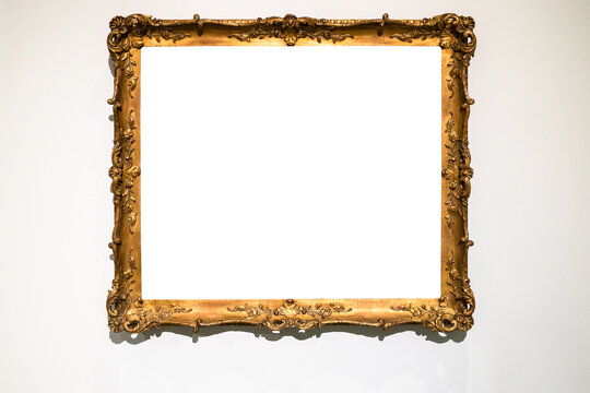 old ornamental golden picture frame on gray wall