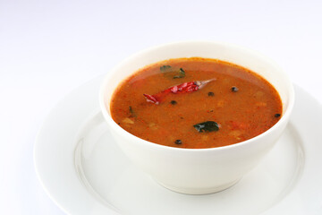 South Indian Rasam, Tamarind juice cooked with spices and tomato, clear soup