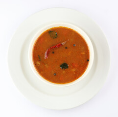 South Indian Rasam, Tamarind juice cooked with spices and tomato, clear soup