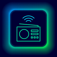 Glowing neon line Smart radio system icon isolated on black background. Internet of things concept with wireless connection. Colorful outline concept. Vector