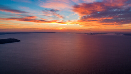Fototapeta na wymiar Beautiful sunrise or sunset near the sea. Photo from a drone. Pink sky. background image