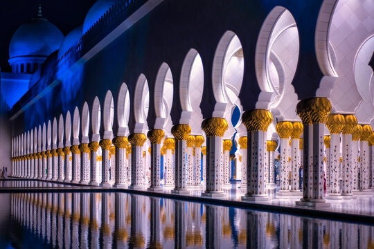 Abu Dhabi Grand mosque piller and its reflection at evening after sunset with lights