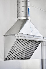 Naklejka premium Cooker hood in the production shop. Installation of a ventilation system in industrial premises