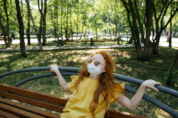 Redhead girl in a disposable mask