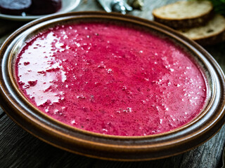 Beetroots soup on wooden table
