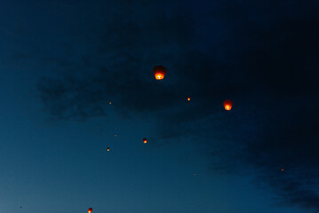 In the evening, at sunset, people with their relatives and friends launch traditional lanterns. Tradition and travel