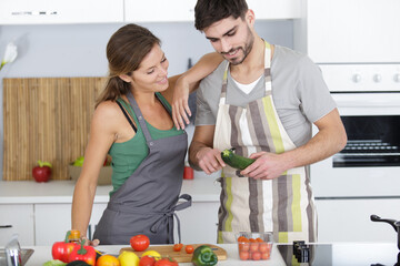 beautiful young couple preparing a healthy meal together