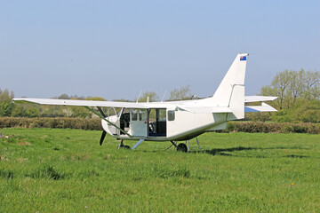 Ultralight airplane on a grass strip	
