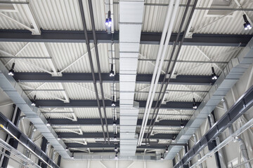 ceiling interior with ventilation pipes and technology of factory building