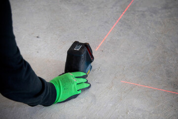 laser rangefinder device on construction site - obrazy, fototapety, plakaty