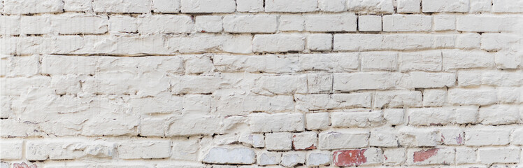 Panoramic scenery with white brick wall with peeling plaster