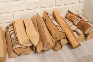 firewood in the decorative fireplace. interior decoration