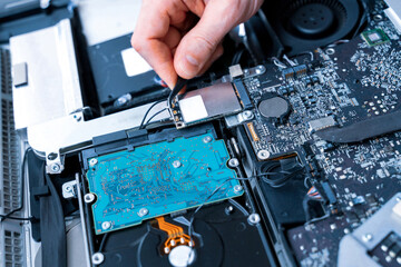 Technology maintenance hardware from man engineer. Repair computers. Electronic technician pc service.