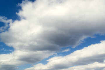 Beautiful clouds in the sky. The cumulus clouds are high in the air.