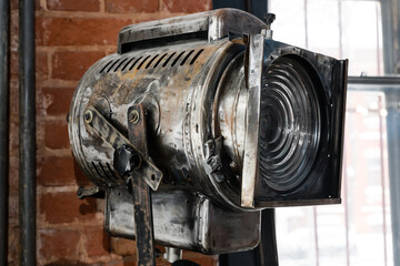 an old vintage movie projector. Lighting and interior decoration in the loft style.