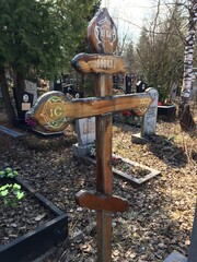 cross in the grave side in the  forest